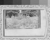 Frank standing with a group in a field of flowers [ jpeg ]